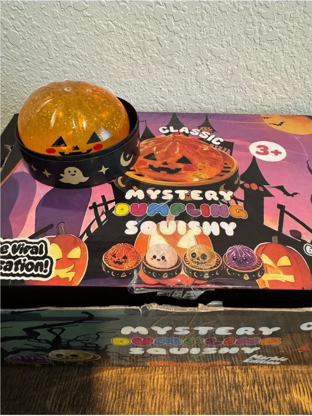 Halloween Pumpkin Dumpling Glitter Squishy w/ Storage Case - Orange Sensory Toy - Picture 6 of 8